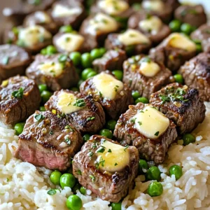 To make Garlic Butter Steak Bites, you need: - 1 lb beef sirloin, cut into bite-sized cubes - 3 tablespoons unsalted butter, divided - 4 cloves garlic, minced - 1 teaspoon fresh thyme leaves (or ½ teaspoon dried thyme) - 1 teaspoon smoked paprika - Salt and black pepper, to taste - 1 cup jasmine rice - 2 cups beef broth (or water) - 1 cup frozen peas - Fresh parsley, chopped, for garnish These ingredients combine to create a rich and flavorful dish that is quick to prepare. The beef sirloin gives a nice bite, while the butter and garlic add depth. You will need a few basic tools: - Medium saucepan for cooking the rice - Large skillet for searing the steak - Wooden spoon or spatula for stirring - Measuring cups and spoons for accurate portions - Knife and cutting board for prepping the ingredients Having these tools ready makes cooking smooth and efficient. It helps you stay organized and focused on the meal. For added flavor and presentation, consider these garnishes: - Fresh parsley, chopped - Extra thyme leaves for a fragrant touch - Lemon wedges for a zesty finish These garnishes not only enhance the look of the dish but also add a fresh taste that brightens each bite. Use them to elevate your Garlic Butter Steak Bites and make your meal even more enjoyable. Start by cooking the jasmine rice. In a medium saucepan, bring 2 cups of beef broth to a boil. You can also use water, but broth adds more flavor. Stir in 1 cup of jasmine rice. Reduce the heat to low. Cover the pot and let it simmer for about 10-12 minutes. The rice will absorb the liquid and become tender. Once done, fluff the rice gently with a fork and keep it warm. While the rice cooks, prepare the steak bites. Use 1 pound of beef sirloin, cut it into bite-sized cubes. This size helps the beef cook quickly. Season the cubes with salt, black pepper, and 1 teaspoon of smoked paprika. Make sure each piece is well-coated for the best flavor. Next, heat a large skillet over medium-high heat. Add 1 tablespoon of unsalted butter once the skillet is hot. When the butter melts and bubbles, add the seasoned steak bites in a single layer. Avoid overcrowding the pan to keep the heat high. Sear the beef for about 2-3 minutes on each side. The cubes should be nicely browned and cooked to your liking. If needed, work in batches to keep the skillet hot. After searing, return all the steak bites to the skillet. Lower the heat to medium. Now, add 4 minced garlic cloves and 1 teaspoon of fresh thyme leaves. Pour in the remaining 2 tablespoons of butter. Sauté everything for 1-2 minutes. Stir often until the garlic becomes fragrant and soft. Now, gently stir in 1 cup of frozen peas. Let them heat through for about 1-2 minutes. Taste the mixture and adjust seasoning with extra salt or black pepper, if needed. Now it’s time to assemble your meal. Take the fluffy jasmine rice and put it on plates. Evenly distribute the garlic butter steak bites and peas over the rice. For a nice touch, garnish each plate with freshly chopped parsley. This adds color and freshness to your dish, making it even more inviting. Enjoy your meal! To make great steak bites, start with good beef. I like beef sirloin for its flavor. Cut the beef into even cubes. This helps them cook at the same time. Season them well with salt, pepper, and smoked paprika. This adds a nice flavor. Heat your skillet over medium-high heat. Add butter and let it melt. Once it bubbles, add the steak in one layer. Don't overcrowd the pan. Cook for 2-3 minutes on each side. Use tongs to turn them. This gives a nice brown crust. For fluffy jasmine rice, use beef broth for extra flavor. Boil it in a medium pot. Add the rice and stir once. Then, reduce the heat and cover. Let it simmer for about 10-12 minutes. Avoid lifting the lid. This keeps the steam in. Once done, fluff the rice with a fork. This helps separate the grains. Keep it warm off the heat until ready to serve. Feel free to adjust the seasonings to fit your taste. If you like more heat, add a pinch of cayenne pepper. For a fresh taste, try adding lemon zest. Fresh herbs like basil or oregano can also add flavor. Always taste as you go. This way, you can make changes to suit your palate. Don’t forget to add a bit more salt and pepper if needed. Enjoy experimenting! {{image_4}} You can swap beef sirloin for other meats. Try chicken, pork, or shrimp. Each protein gives a unique taste. For chicken, use thighs for juiciness. Pork tenderloin works well too. If you choose shrimp, cook them until they turn pink. This change adds a fun twist to your meal. While jasmine rice is great, you can use other types. Brown rice is a healthy choice and adds a nutty flavor. If you want something different, try basmati rice. It has a lovely aroma and texture. You can also cook rice in chicken broth for extra taste. Adding herbs or spices to the rice can make it even better. Consider saffron or turmeric for a vibrant color and flavor. For a meatless version, try using mushrooms. Portobello or shiitake mushrooms have a meaty texture. You can also use tofu or tempeh for plant-based protein. Season them like you would the steak, using garlic and thyme. This way, you still get all the rich flavors. To keep your garlic butter steak bites and rice fresh, store them in airtight containers. Let the dish cool down before sealing. This helps prevent moisture buildup. You can keep leftovers in the fridge for up to three days. Label the containers with the date to track freshness. When it’s time to enjoy your leftovers, use the stovetop or microwave. For stovetop reheating, place the steak bites and rice in a skillet over medium heat. Add a splash of beef broth or water to keep it moist. Stir occasionally until heated through, about 5-7 minutes. In the microwave, cover the dish and heat for 2-3 minutes, stirring halfway. Check that it’s hot all the way through before eating. If you want to store your meal longer, freezing is a great option. Portion the garlic butter steak bites and rice into freezer-safe bags or containers. Make sure to remove as much air as possible. This helps prevent freezer burn. You can freeze the dish for up to three months. When ready to eat, thaw it in the fridge overnight and then reheat using the stovetop or microwave methods described above. Yes, you can use other rice types. Long-grain rice or basmati rice work well. Just adjust the cooking time according to the rice type you choose. Keep in mind that different rice may change the dish's flavor slightly. If you want to swap beef sirloin, try using tender cuts like ribeye or filet mignon. You can also use chicken breast or shrimp for a different flavor. Each option will give you a tasty meal, but cooking times may vary. Cooking steak bites takes about 6 to 8 minutes. Sear them for 2 to 3 minutes on each side. The time may change based on how cooked you want the steak. Always check for doneness to ensure a perfect bite. Yes, you can make this dish without peas. If you prefer, add other vegetables like bell peppers or broccoli. They will add color and nutrition without changing the cooking method. Feel free to customize the dish to your taste! In this blog post, we explored how to make delicious garlic butter steak bites. We covered the key ingredients, cooking tools, and suggested garnishes. You learned step-by-step instructions, helpful tips, and variations to try. Remember, practice makes perfect when cooking steak. With the right ingredients and techniques, you can impress anyone at your table. Enjoy your cooking journey!
