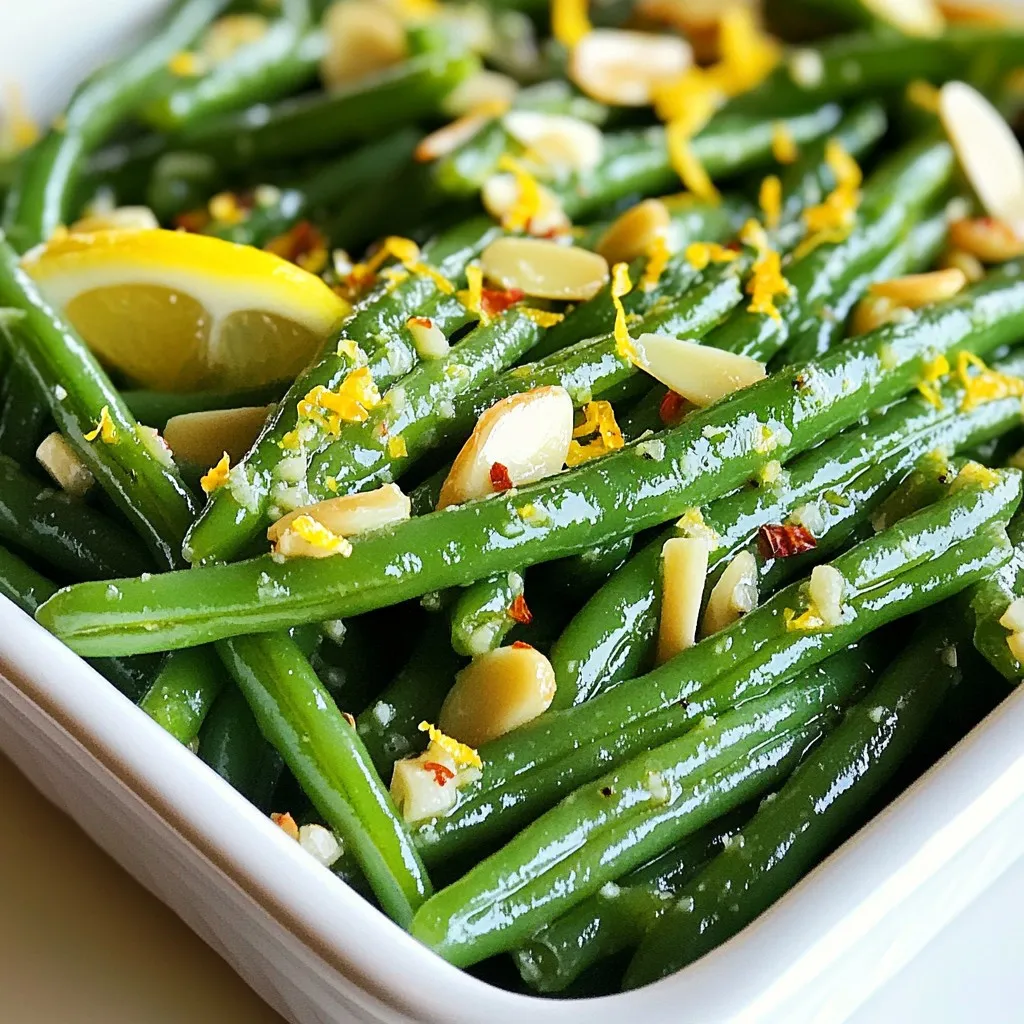 To make Garlic Butter Green Beans, you need a few simple ingredients. Here’s what you’ll need: - 1 lb fresh green beans, trimmed - 4 tablespoons unsalted butter - 4 cloves garlic, finely minced - 1 teaspoon fresh lemon zest - 1 tablespoon fresh lemon juice - Salt and freshly ground black pepper, to taste - ¼ teaspoon red pepper flakes (optional for a spicy kick) - 2 tablespoons sliced almonds, toasted (optional for garnish) These ingredients come together to create a bright and buttery dish. The fresh green beans give a crisp texture. The garlic adds depth, while lemon brightens the flavor. You can adjust the salt and pepper to your taste. If you like heat, the red pepper flakes are a fun touch. Lastly, the sliced almonds add a nice crunch. This combination makes for a side dish everyone will love. {{ingredient_image_2}} - Fill a large pot with water and add a pinch of salt. - Bring the water to a rolling boil over high heat. - Carefully add the trimmed green beans to the boiling water. - Boil the green beans for 4-5 minutes. They should turn bright green and stay crisp. - While they boil, prepare an ice bath. Fill a large bowl with cold water and ice. - Once the green beans finish cooking, use a slotted spoon to transfer them to the ice bath. This stops the cooking. - In a large skillet, melt the butter over medium heat. Make sure it spreads evenly. - When the butter is melted and sizzling, add the minced garlic. - Sauté the garlic for 1-2 minutes. Stir it often until it becomes fragrant and golden brown. Be careful not to burn the garlic. - Drain the green beans from the ice bath and add them to the skillet. - Toss the green beans gently in the garlic butter. Make sure each bean gets coated. - Sprinkle in the lemon zest and pour the lemon juice over the green beans. - Season with salt, black pepper, and red pepper flakes if you like spice. - Toss everything again so the flavors mix well. - Let the green beans sauté in the garlic butter for 2-3 more minutes. - They should heat through and look shiny from the butter. - Remove the skillet from heat and transfer the green beans to a serving dish. - If you wish, sprinkle toasted sliced almonds on top for crunch and beauty. To get the best green beans, look for bright green, firm ones. They should be crisp when you snap them. Avoid beans with brown spots or shriveled ends. After you pick them, use an ice bath right away. This bath stops cooking and keeps their bright color. Fill a bowl with cold water and ice. When you finish boiling the beans, drop them in the ice bath for a few minutes. Garlic can turn bitter if it burns. To avoid this, keep your heat low to medium. Watch it closely while it cooks. Add the minced garlic once the butter is bubbling. Stir often for one to two minutes. You want it golden, not dark brown. Timing is key. Remove it from heat as soon as it smells good. To serve your green beans, choose a white dish. The bright color of the beans will pop against the white. For a bit of crunch and flair, add toasted sliced almonds on top. This adds texture and makes the dish look fancy. A little lemon zest can also add a nice finish. Pro Tips Blanching for Bright Color: Blanching the green beans in boiling water and then shocking them in an ice bath helps to preserve their vibrant green color and crisp texture. Fresh Garlic Matters: Using fresh garlic instead of pre-minced or powdered garlic will enhance the flavor of the dish significantly, providing a more aromatic and flavorful experience. Adjusting Spice Levels: If you prefer a milder flavor, you can omit the red pepper flakes, or adjust the amount according to your taste for a customized spicy kick. Toast the Almonds: Toasting the sliced almonds before garnishing adds a delightful crunch and enhances their nutty flavor, making your dish more satisfying. {{image_4}} You can boost your Garlic Butter Green Beans by adding protein. Chicken and shrimp make great choices. For chicken, use thin strips. Cook them in the garlic butter first. Then, toss in the green beans. For shrimp, add them after the garlic is fragrant. Cook until they turn pink, then mix in the green beans. This adds flavor and makes the dish more filling. You can change the taste of your green beans with herbs. Try fresh thyme, parsley, or basil. Just chop them finely and add them to the garlic butter. Each herb brings a new flavor. You could also mix in cheese for a creamy touch. Feta or Parmesan work well. Sprinkle it on top before serving for added richness and taste. If you want a healthier option, swap butter for olive oil. Use the same amount of oil and heat it in the skillet. The taste will change a bit, but it will still be delicious. For a quicker option, you can use garlic powder instead of fresh garlic. Use about 1 teaspoon of garlic powder when you add the oil. This keeps the flavor strong without extra work. To keep your garlic butter green beans fresh, store them in the fridge. Use an airtight container to seal in the flavors. The beans will stay good for about 3 to 5 days in the refrigerator. If you want to save space, divide them into smaller portions. This makes it easy to grab a quick side dish later. When reheating, I recommend using a skillet. Heat it over medium-low heat and add a touch of olive oil. This method warms the beans evenly and helps keep them crisp. Avoid using a microwave if you can. Microwaving can make the beans soggy. Stir the beans gently while they heat. This keeps them from clumping together or losing texture. Enjoy your delicious green beans just as they were meant to be! To make Garlic Butter Green Beans vegan, swap butter for vegan butter or olive oil. Use garlic and seasonings as usual. You can add lemon juice for freshness. This keeps the dish tasty and plant-based. Yes, you can use frozen green beans. Just cook them according to the package instructions. Keep in mind they may not have the same crispness as fresh beans. Garlic Butter Green Beans pair well with many dishes. Try serving them with grilled chicken, steak, or fish. They also work great with pasta or rice for a filling meal. To prevent mushy green beans, cook them quickly. Boil for only 4-5 minutes until bright green. Then, move them to an ice bath right away. This stops the cooking and keeps them crisp. This post covered how to make tasty Garlic Butter Green Beans. We highlighted fresh ingredients and step-by-step cooking tips. By boiling and sautéing, you create a delicious dish that's full of flavor. Remember the ice bath to keep your green beans crisp. Feel free to adjust the recipe to your taste with different herbs or proteins. You can also easily store leftovers for later enjoyment. I hope you feel ready to try this simple yet delightful recipe for your meals. Enjoy your cooking!