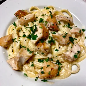 - Chicken: 1 pound diced boneless, skinless chicken breasts - Pasta: 12 ounces fettuccine or preferred type - Broth and Seasonings: 3 cups low-sodium chicken broth, garlic powder, Italian seasoning - Cream and Cheese: 1 cup heavy whipping cream, 1 cup freshly grated Parmesan cheese - Garnish: Fresh parsley, extra virgin olive oil, sea salt, and black pepper This dish starts with fresh chicken. I like to use diced boneless, skinless chicken breasts. They cook fast and stay tender. You will need 1 pound. Next, choose your pasta. I often use fettuccine for its wide shape. It holds sauce well, but any pasta you like will work. You need 12 ounces. For flavor, we need broth and seasonings. Use 3 cups of low-sodium chicken broth for a good base. Garlic powder adds a nice kick, and Italian seasoning brings warmth. Now, we add cream and cheese. Heavy whipping cream makes the sauce rich. You will also need 1 cup of freshly grated Parmesan cheese for that classic taste. Finally, don't forget the garnish. Fresh parsley adds color and a fresh taste. Use extra virgin olive oil, sea salt, and black pepper to round out the flavors. With these ingredients, you are on your way to a creamy and quick chicken Alfredo! {{ingredient_image_2}} To start, set your Instant Pot to the saut&eacute; function. Pour in 2 tablespoons of olive oil. Wait until it shimmers. Then, add 1 pound of diced chicken. Sprinkle it with 1 teaspoon of garlic powder, 1 teaspoon of Italian seasoning, sea salt, and black pepper. Cook the chicken for about 5 to 7 minutes. Stir occasionally until the chicken is no longer pink. This step builds great flavor. Next, carefully pour in 3 cups of low-sodium chicken broth. Gently stir to scrape up any bits stuck to the bottom. These bits add flavor. Add 12 ounces of fettuccine pasta. Press the pasta down into the broth, but do not stir. Ensure all the pasta is below the liquid. This helps it cook evenly and prevents sticking. Now, secure the lid on the Instant Pot. Make sure the steam valve is set to sealing. Cook on high pressure for 8 minutes. Once cooking is done, let the pressure release naturally for 5 minutes. After that, use the quick release to let out any remaining steam. This method gives you tender pasta and juicy chicken. After opening the lid, pour in 1 cup of heavy cream. Sprinkle 1 cup of grated Parmesan cheese on top. Stir until the sauce is creamy and well mixed. If the sauce is too thick, add a little more chicken broth. Taste the sauce and adjust the seasoning with more salt and pepper if needed. Serve the chicken Alfredo in warm bowls. Garnish with chopped parsley for a fresh touch. For a creamy sauce, aim for a smooth consistency. If your sauce is too thick, add a splash of chicken broth. Stir gently to blend until you reach your desired thickness. For a richer flavor, taste as you go. Adjust salt and pepper to make it just right. When saut&eacute;ing chicken, ensure it browns evenly. This step builds flavor. Avoid overcrowding the pot. Cook in batches if needed. For pressure cooking, always check that the steam valve is sealed. Common mistakes include stirring the pasta in the broth. Instead, press it down gently to keep it submerged. Serve your Alfredo in warm bowls. Top each dish with extra Parmesan and a sprinkle of parsley. This adds color and fresh flavor. For sides, pair with garlic bread or a light salad. These choices balance the richness of the dish and create a complete meal. Pro Tips Use Fresh Ingredients: Freshly grated Parmesan cheese melts better and provides a richer flavor than pre-grated options. Always aim for the freshest ingredients to enhance the taste of your dish. Customize the Seasoning: Feel free to adjust the garlic powder and Italian seasoning according to your taste preference. Adding a pinch of red pepper flakes can also give your Alfredo a pleasant kick. Don&rsquo;t Overcook the Pasta: Since the pasta cooks in the Instant Pot with the chicken and broth, ensure you follow the timing closely. Undercooking slightly will allow it to absorb the sauce without becoming mushy. Garnish for Presentation: A sprinkle of freshly chopped parsley not only adds a pop of color but also freshness to the dish. Consider adding a few extra shavings of Parmesan for that restaurant-style finish. {{image_4}} You can easily switch proteins in this dish. Try using shrimp or tofu instead of chicken. Shrimp cooks fast, so add it in the last few minutes. Tofu is great too! Use firm tofu, diced, and saut&eacute; it like the chicken. If you want a vegetarian option, skip the meat entirely. Load up on vegetables like mushrooms, spinach, or broccoli. These add flavor and nutrition. You can saut&eacute; them with the olive oil before adding the broth and pasta. Adding vegetables or spices can make the dish pop. Try spinach or sun-dried tomatoes for color and taste. You can also add red pepper flakes for a kick. For a creative twist, use different cheeses. Goat cheese gives a tangy flavor, while smoked gouda brings depth. You can even add a squeeze of lemon for brightness. These simple changes can make your Instant Pot Chicken Alfredo fun and new. Enjoy exploring your options! To keep your Chicken Alfredo fresh, place it in an airtight container. Make sure it cools down before sealing. Store it in the fridge for up to three days. This helps maintain its flavor and texture. For longer storage, freeze the dish. Pour it into freezer-safe bags or containers. Remove as much air as possible. It can last up to three months in the freezer. When you're ready to eat, thaw it overnight in the fridge. To reheat, use the microwave or stovetop. If using the microwave, heat in short bursts. Stir often to avoid hot spots. On the stovetop, gently warm it in a pan. Add a splash of chicken broth to help restore creaminess. Chicken Alfredo stays fresh for about three days in the fridge. After that, it may lose taste and quality. Always check for signs of spoilage. If it smells off or has a change in color, do not eat it. Look for mold or an unusual texture. If you notice any of these signs, discard the dish. It is better to be safe than sorry when it comes to food safety. You can use many types of pasta for your Instant Pot Chicken Alfredo. Fettuccine is a classic choice, known for its wide shape that holds the sauce well. Here are some other great options: - Penne: Cooks in about 8 minutes. - Rotini: Also takes 8 minutes and adds a fun twist. - Spaghetti: Cooks in 8 minutes but may require extra care to keep it submerged. Just remember, cooking times may vary by brand. Check the package for exact times. When using the Instant Pot, you should press the pasta down into the liquid without stirring. This ensures even cooking and prevents sticking. Yes, this recipe is great for meal prep! You can make a big batch and store it for later. Here are some tips: - Cool Down: Let the dish cool before storing. This helps keep it fresh. - Use Airtight Containers: Store in individual portions for easy meals. - Refrigerate: It will stay fresh for 3-4 days in the fridge. You can also freeze it! Just remember to leave some space in the container, as the pasta will expand. When you&rsquo;re ready to eat, thaw in the fridge overnight. Absolutely! You can make this dish dairy-free by swapping out some ingredients. Here are some ideas: - Cream: Use coconut cream or cashew cream as a substitute. - Cheese: Try nutritional yeast for a cheesy flavor without dairy. - Butter: Use olive oil or dairy-free butter instead. These swaps will still give you a creamy and tasty result. Just adjust your seasonings to suit your taste. Reheating can be tricky, but you can keep your Alfredo creamy. Here are some methods: - Stovetop: Heat on low in a saucepan. Add a splash of chicken broth or cream to help it rehydrate. - Microwave: Use a microwave-safe dish. Heat in short bursts, stirring often. Add liquid as needed to keep it creamy. Avoid high heat, as this can make the sauce too thick or grainy. By using these methods, you&rsquo;ll enjoy tasty leftovers each time! This blog post shared a simple way to make Instant Pot Chicken Alfredo. We covered key ingredients, detailed steps, helpful tips, and variations. Whether you want to substitute proteins or add more veggies, options abound. Don't forget to store leftovers properly to maintain freshness. With these strategies, you can impress your family at dinner. Enjoy the creamy taste, and feel free to get creative with your own twists!